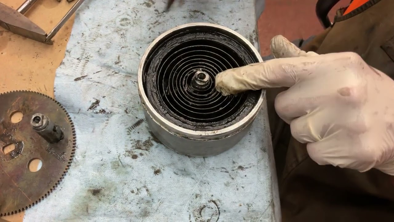 1240.  How to remove the spring from the center shaft arbor on the Chaney motor￼