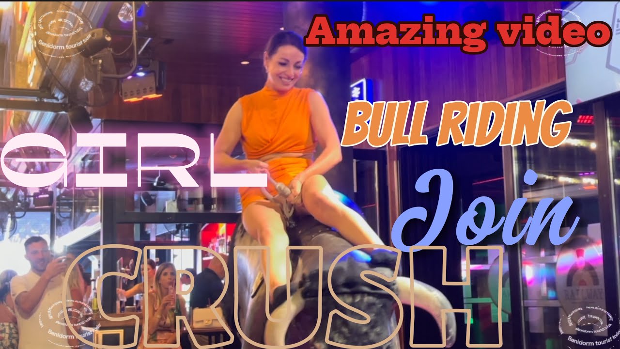 Girl in orange 🍊 dress 👗 tonight bull riding! Mechanical bull 🐂 Benidorm bull riding