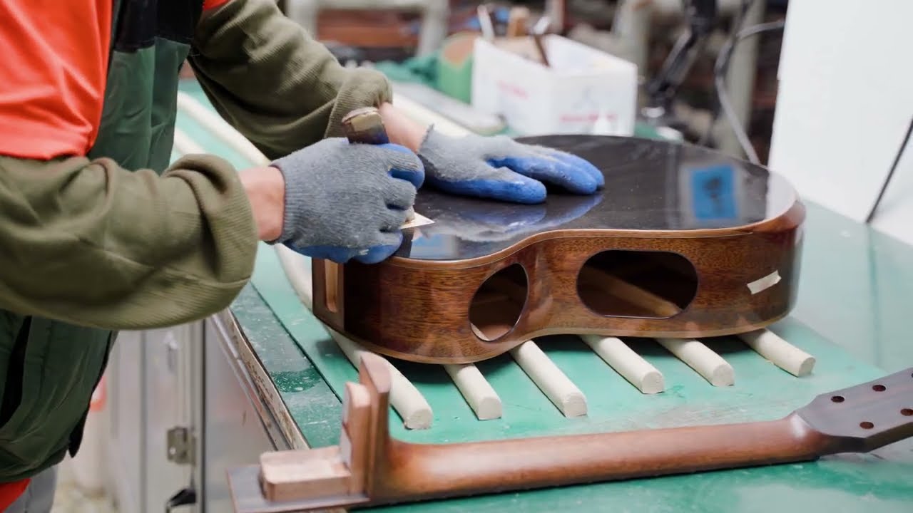 Inside the Making of Cort's Modern Black Acoustic Guitar