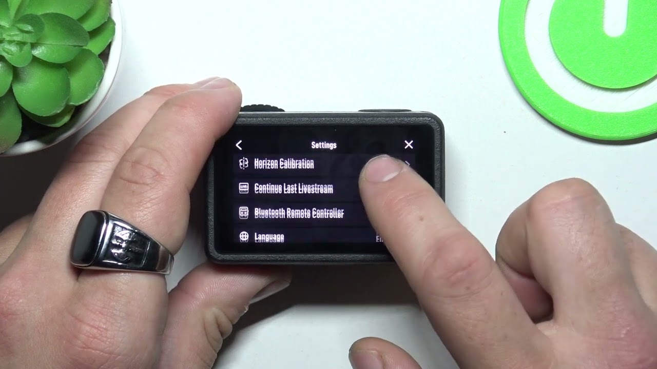 Как управлять настройками Bluetooth пульта дистанционного управления на DJI Osmo Action 5 Pro?