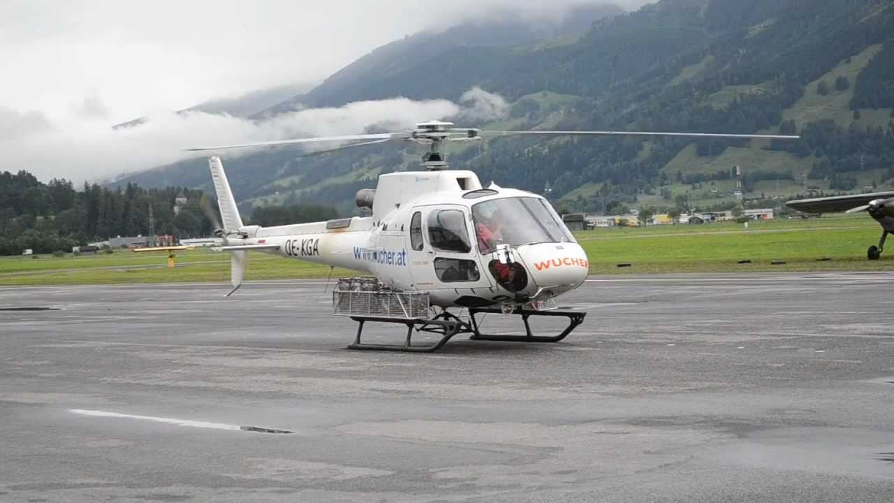 Eurocopter As-350 Wucher helicopters morning check-round at Zell am See airport, Austria