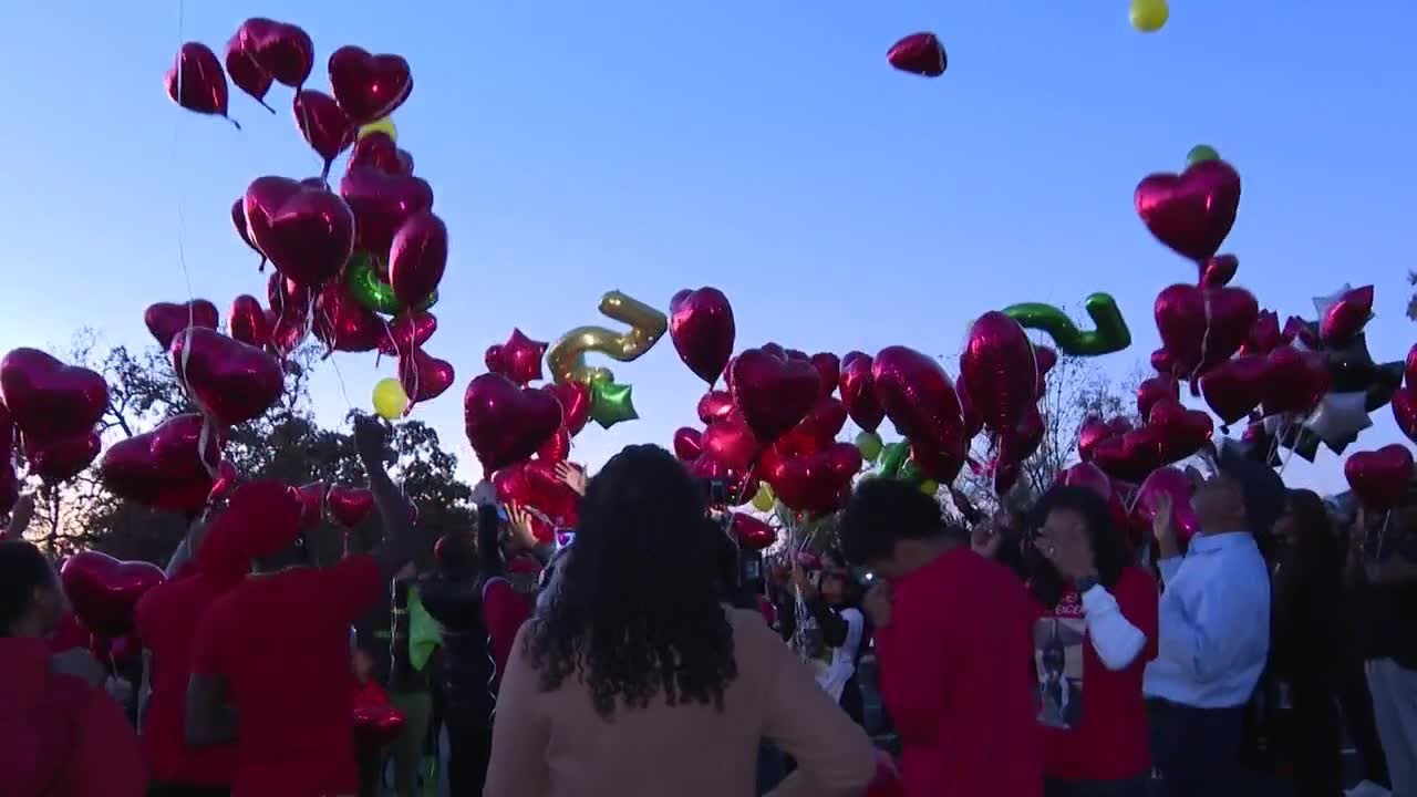 Erik Spencer's family and friends release balloons to celebrate his life