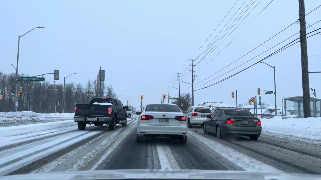 Driving southbound on McCowan Road, turn to Carlton Road in Markham, Ontario, during a snowstorm.