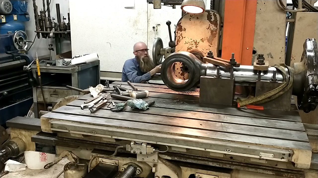 Large worn hydraulic cylinder eye, weld and re-bore on the horizontal boring mill.