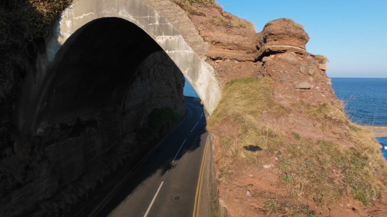 Investigating Caves and arches by the sea | FPV drone video