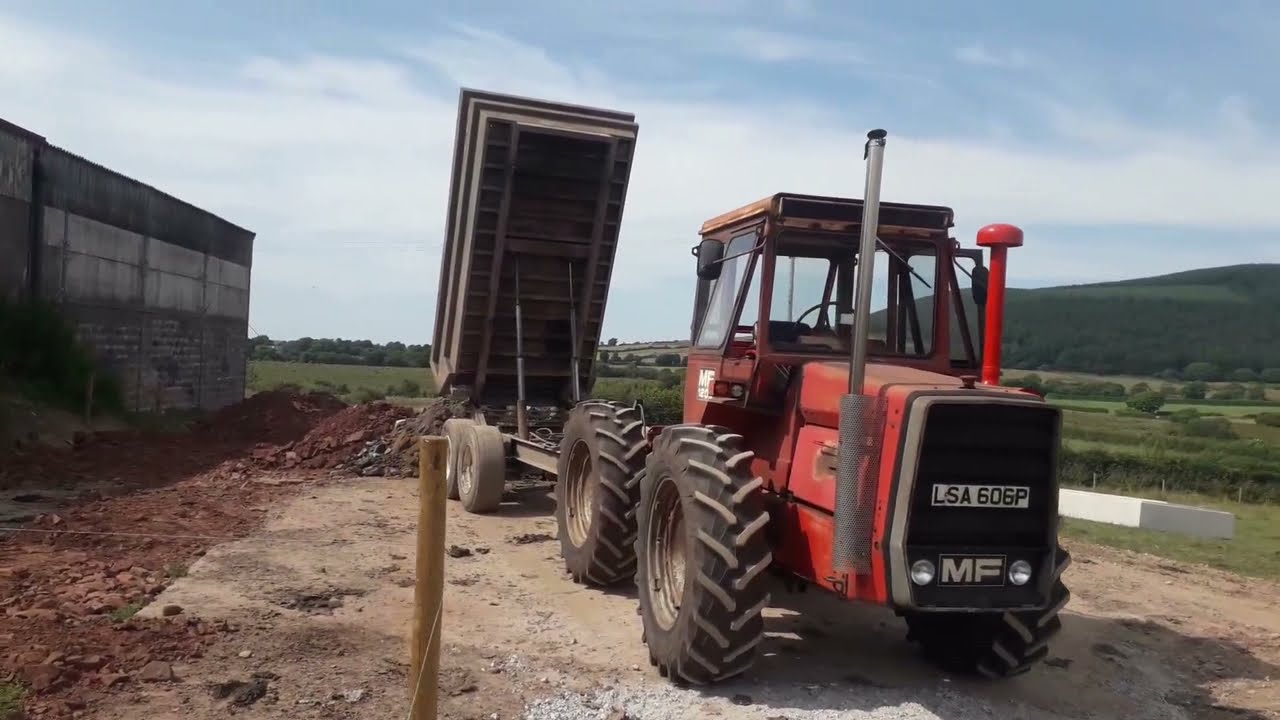 Massey Ferguson 1200 pulling Dump Trailer