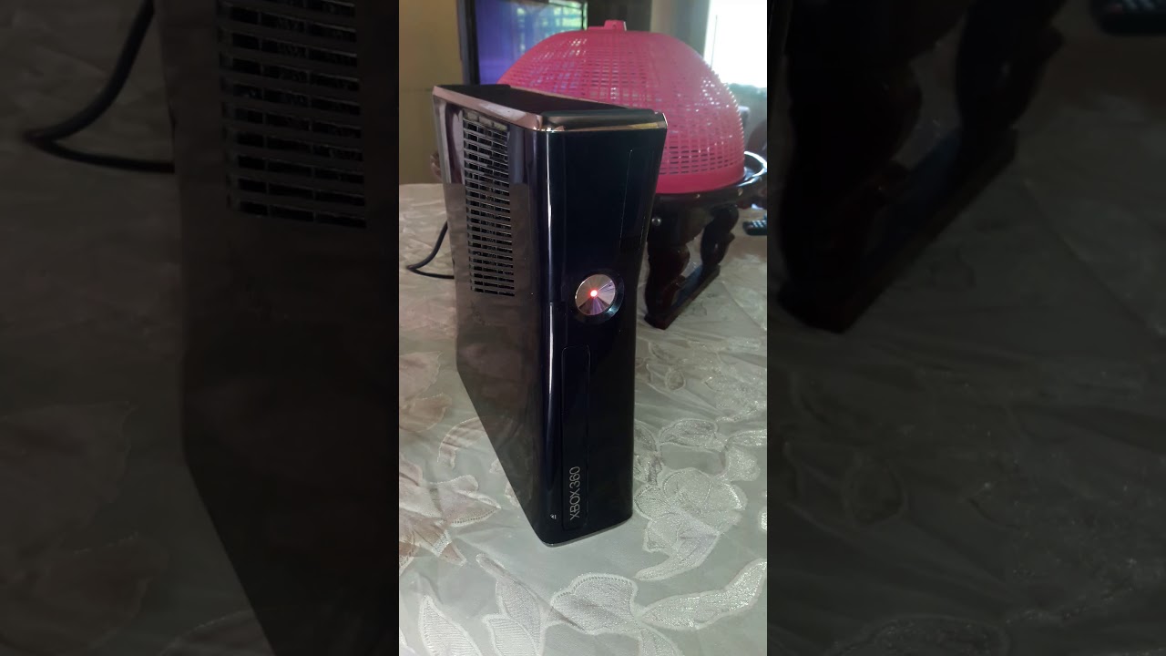 Xbox 360 slim has red dot and wont work....(i need help)