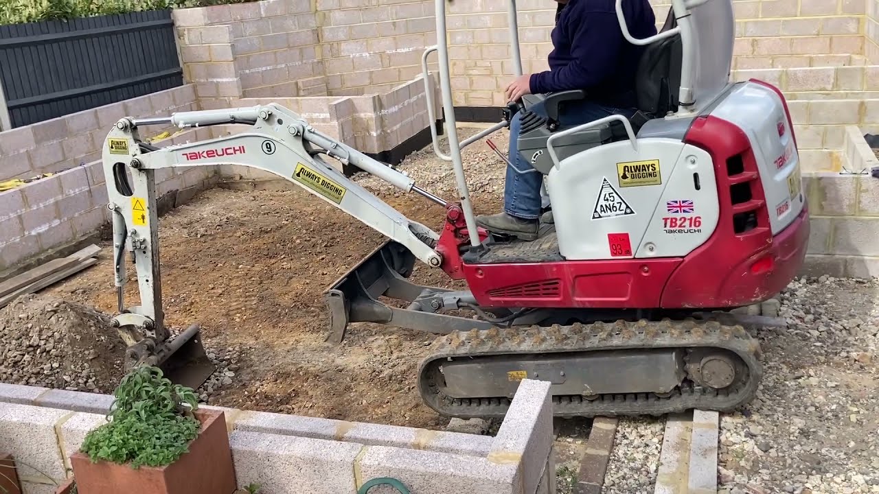 Getting my Takeuchi TB216 out of a sunken garden area.