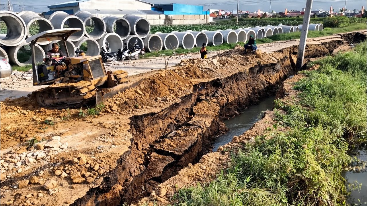Small Dozer Pushing Soil Filling Land In New Village