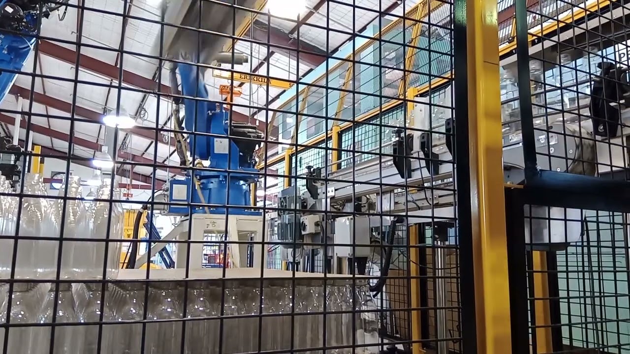 Yaskawa 50 Kg payload robot palletizing bottles.