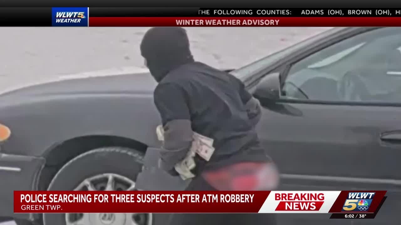 Photos show suspects fleeing with cash, gun after ATM robbery on Cincinnati's west side