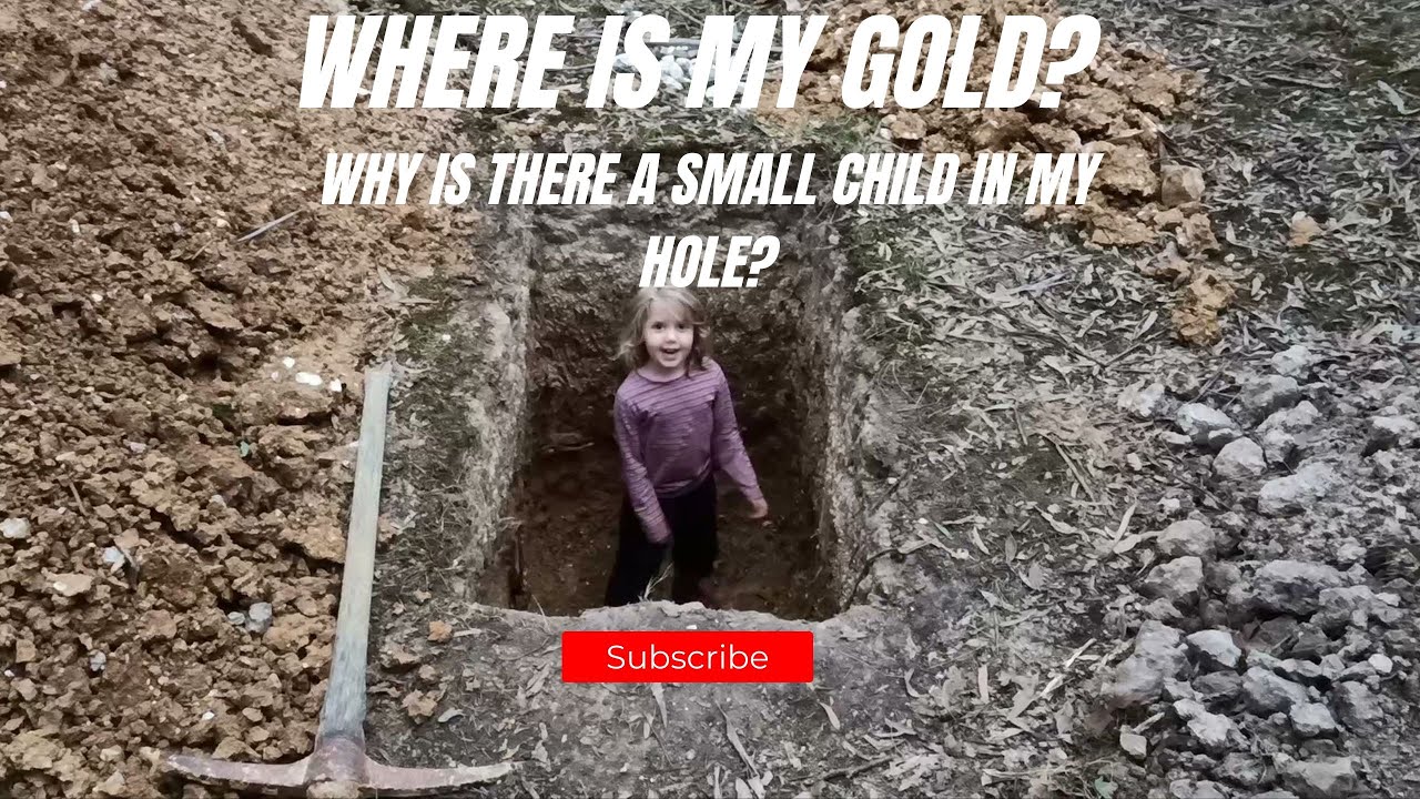 Little helper in the hole, chasing alluvial gold with the kids.