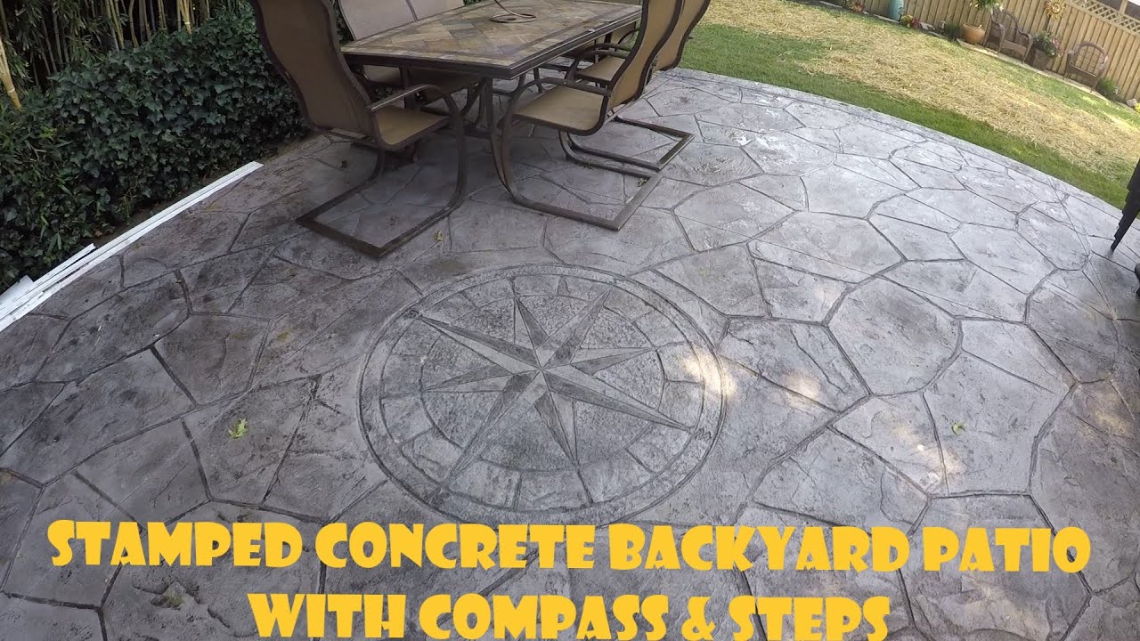 Stamped Concrete Backyard Patio with Compass & Steps
