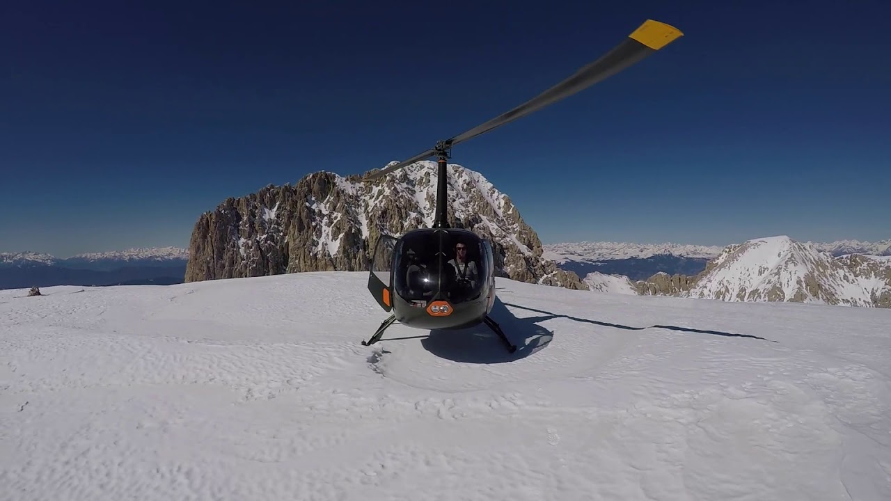 Helicopter R66 following the Alps. Austria to France.