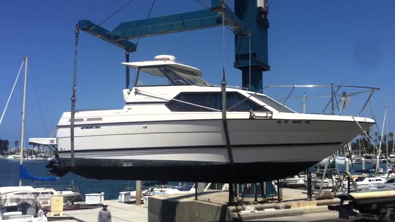 Crane drops boat in water