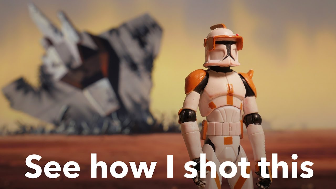 Photographing toys with themed backgrounds
