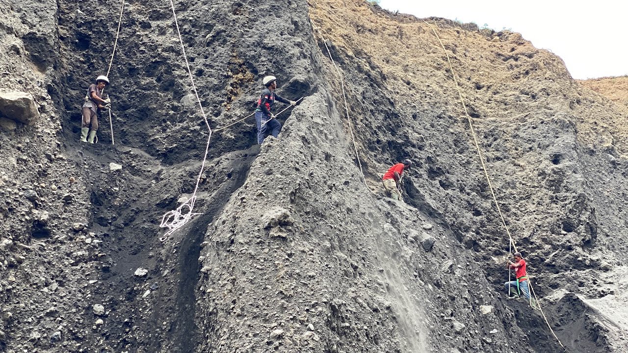 These four men seemed to be competing to destroy the cliff