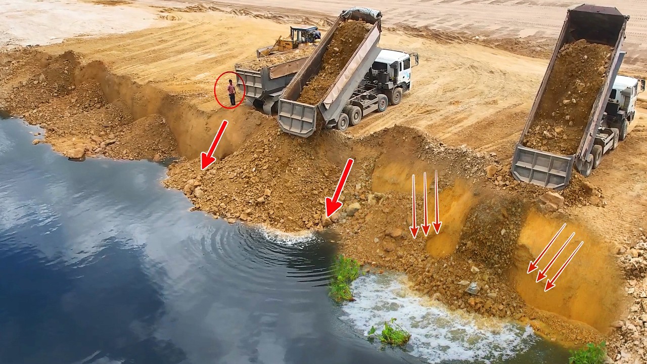 Be Amazing video of rock being dropped into the deepest lake ever by a 25Ton & KOMATSU Dozer pushing