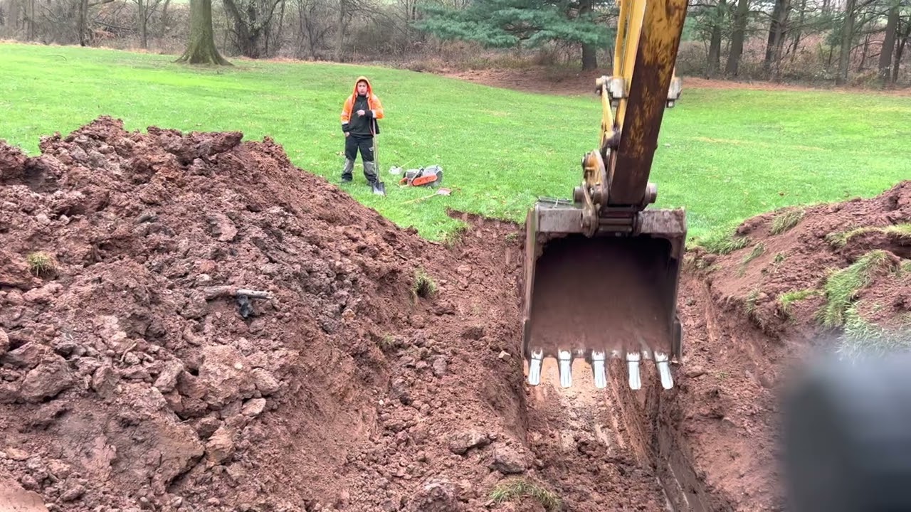 24 in storm pipe HDPE installation with Bartlett and the boys part 1 cat 312C