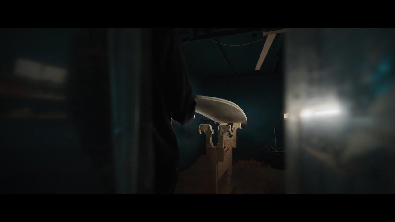 Shaping a wooden surfboard