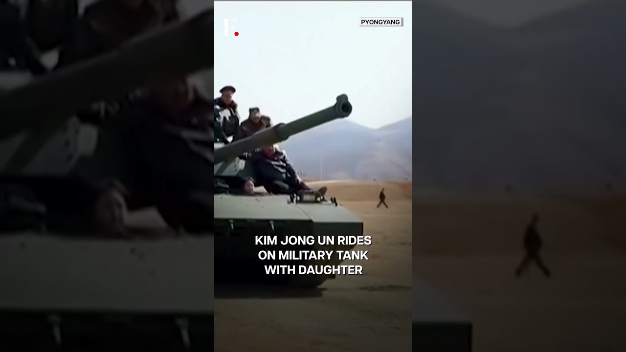 North Korea: Kim Jong Un, Daughter Ride on Tank During Military Drills | Subscribe to Firstpost