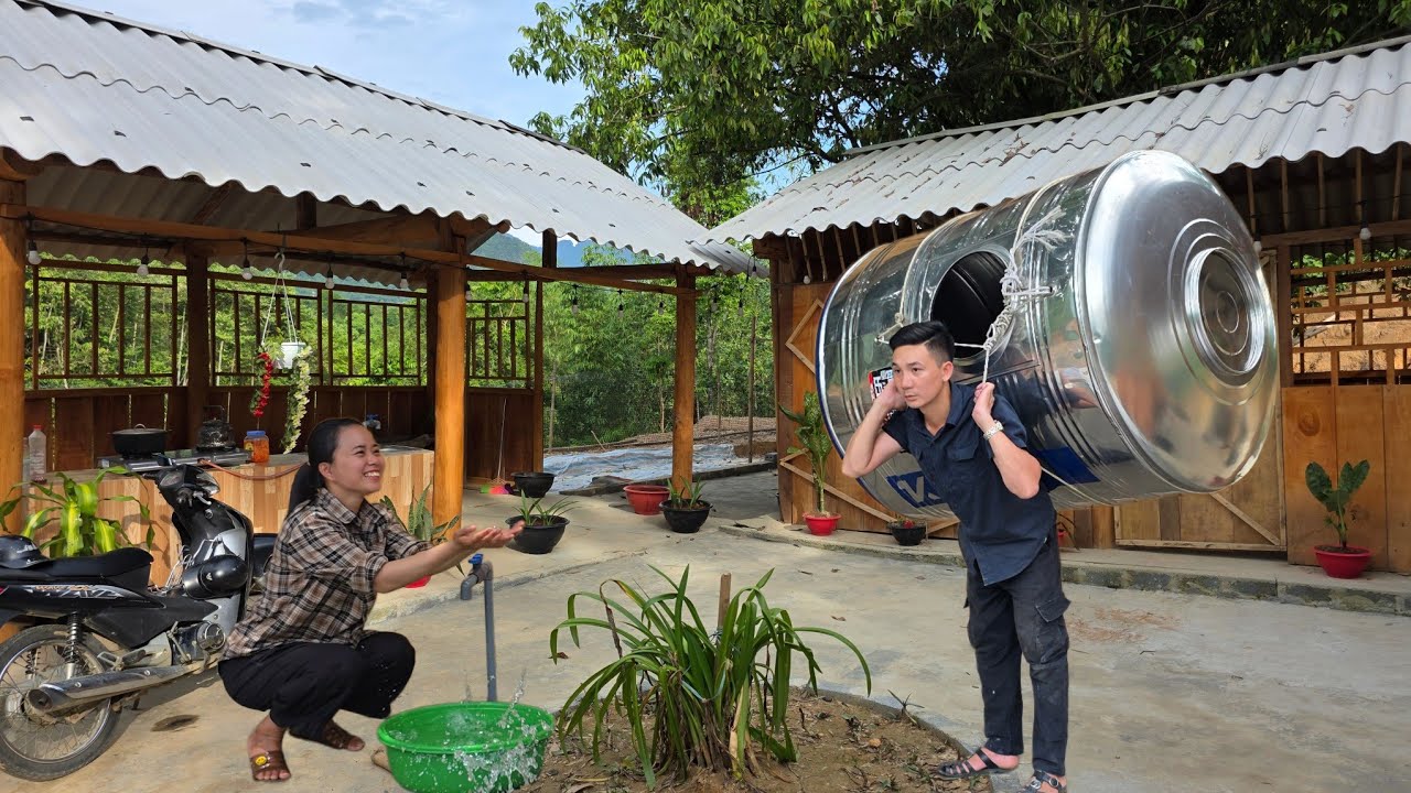 Tieu Ly was delighted when Jack brought home a very large water tank for their new house.
