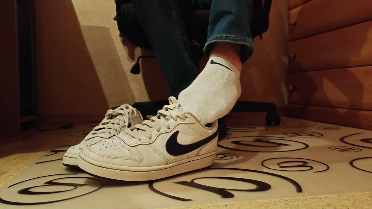 Boy feet socks and nike sneaker shoe play