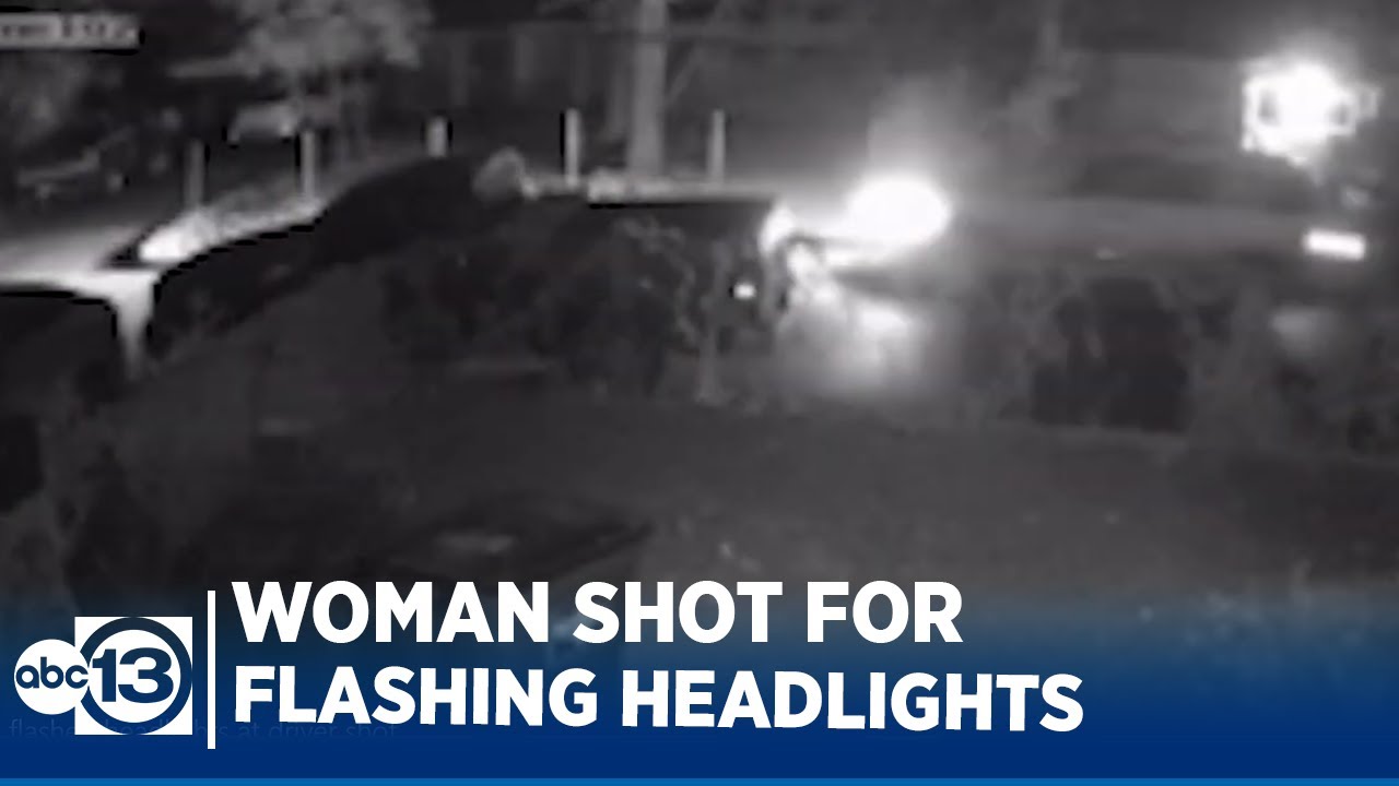 Woman who flashed headlights at driver shot