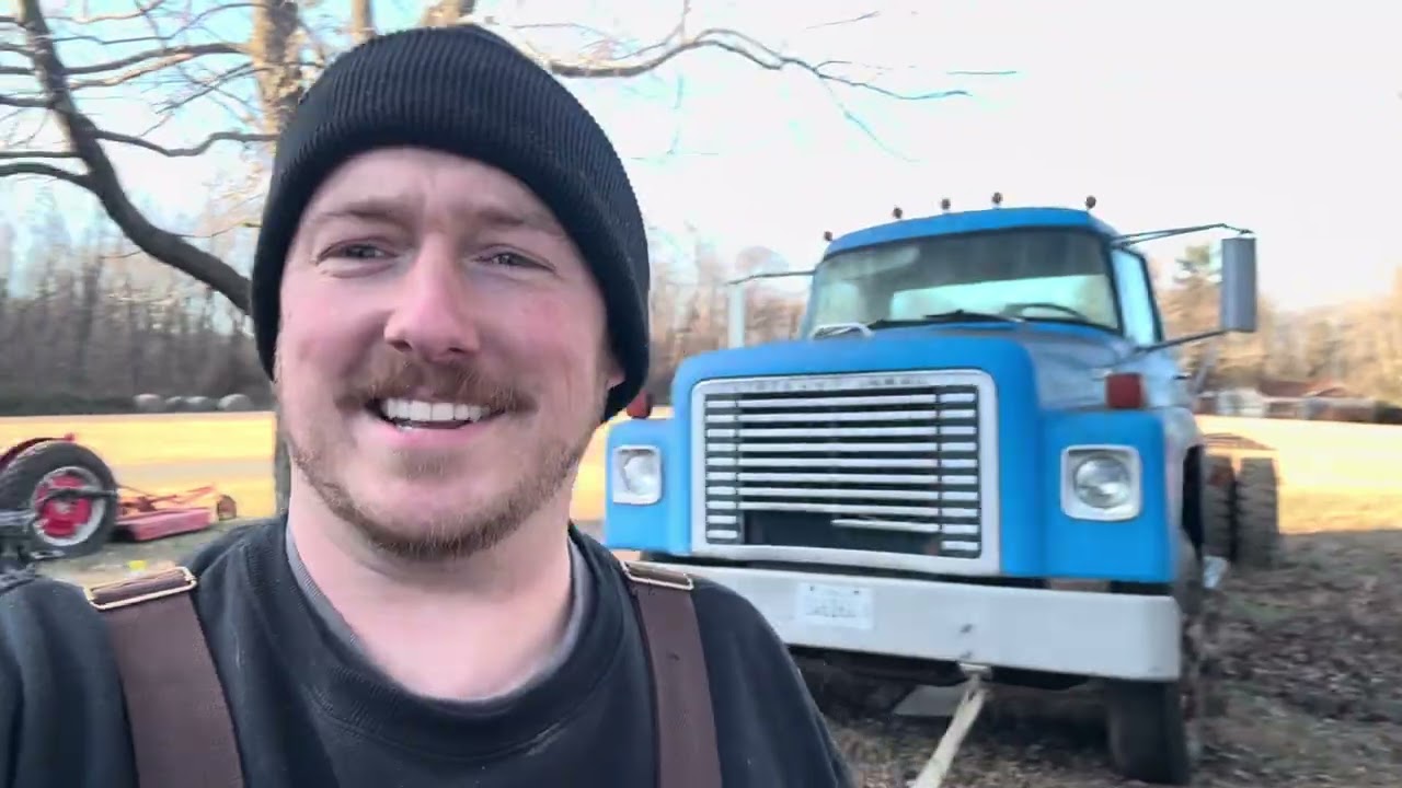 Using one big truck to move another. 