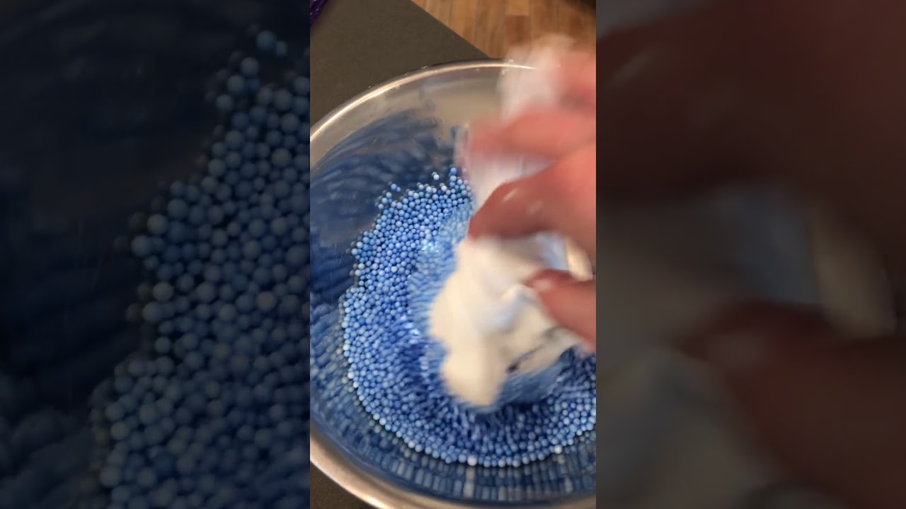 Mixing foam beads into slime!