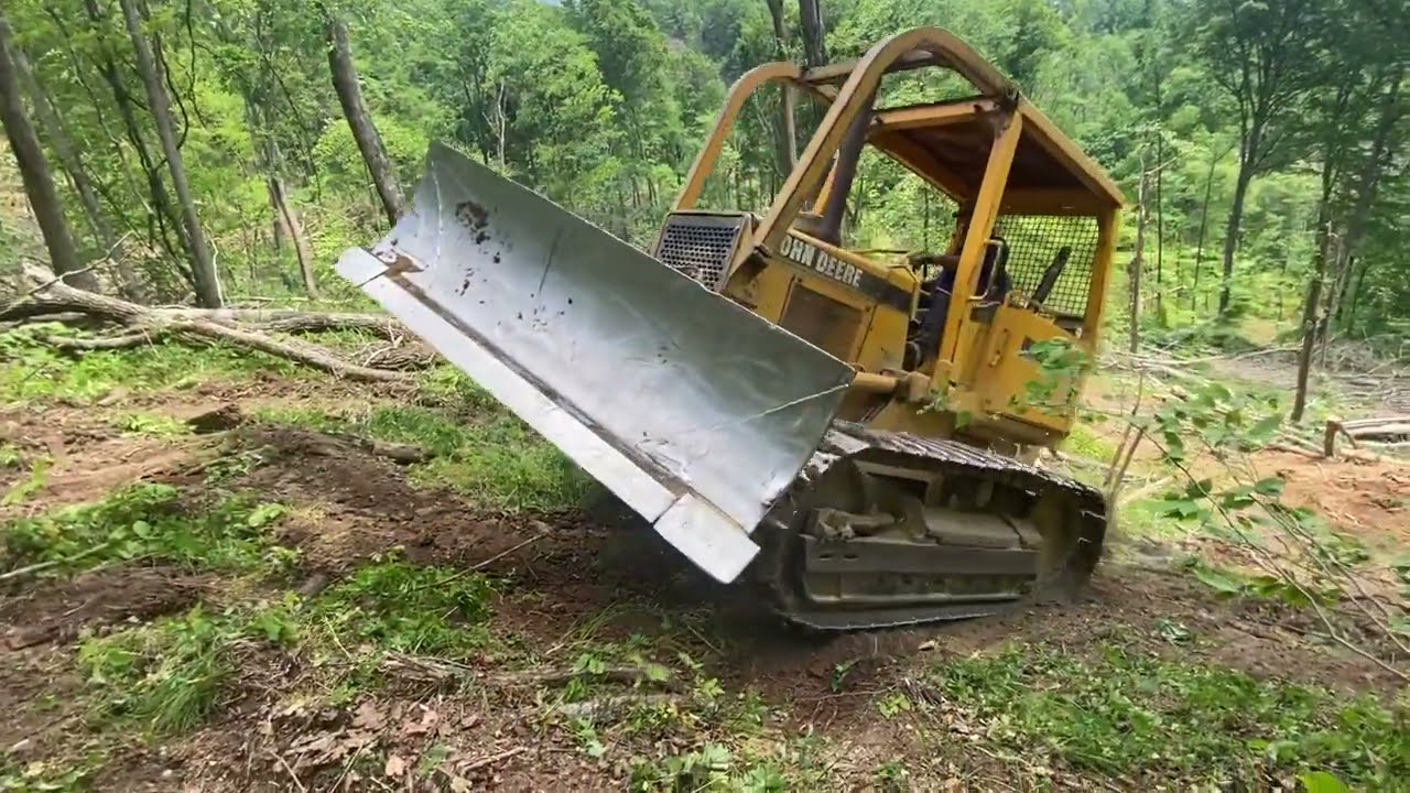 John Deere Dozer making logging roads  G660 first tree