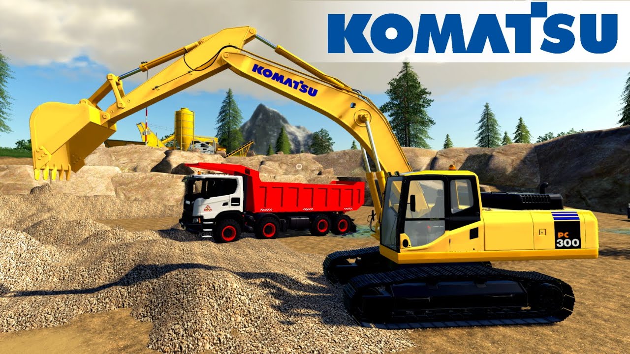 KOMATSU PC300 Excavator Loads Gravel Into A Scania Dump Truck