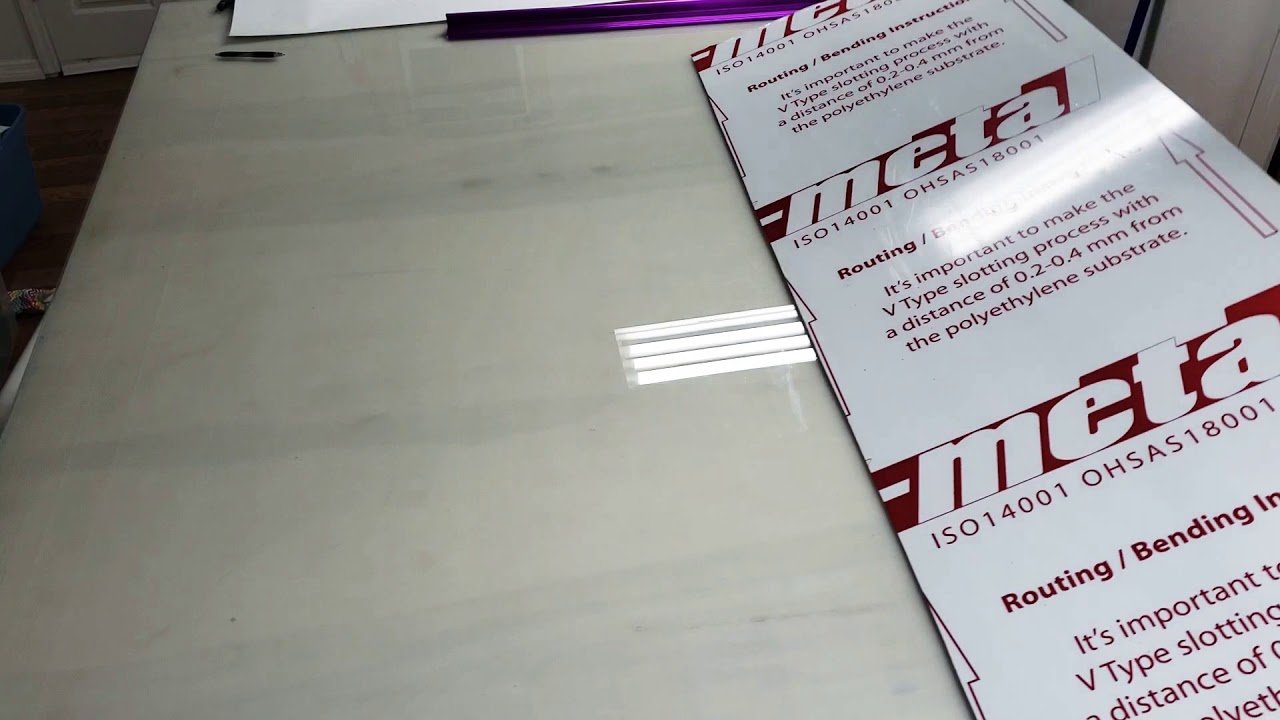 Applying printed vinyl to a sign board