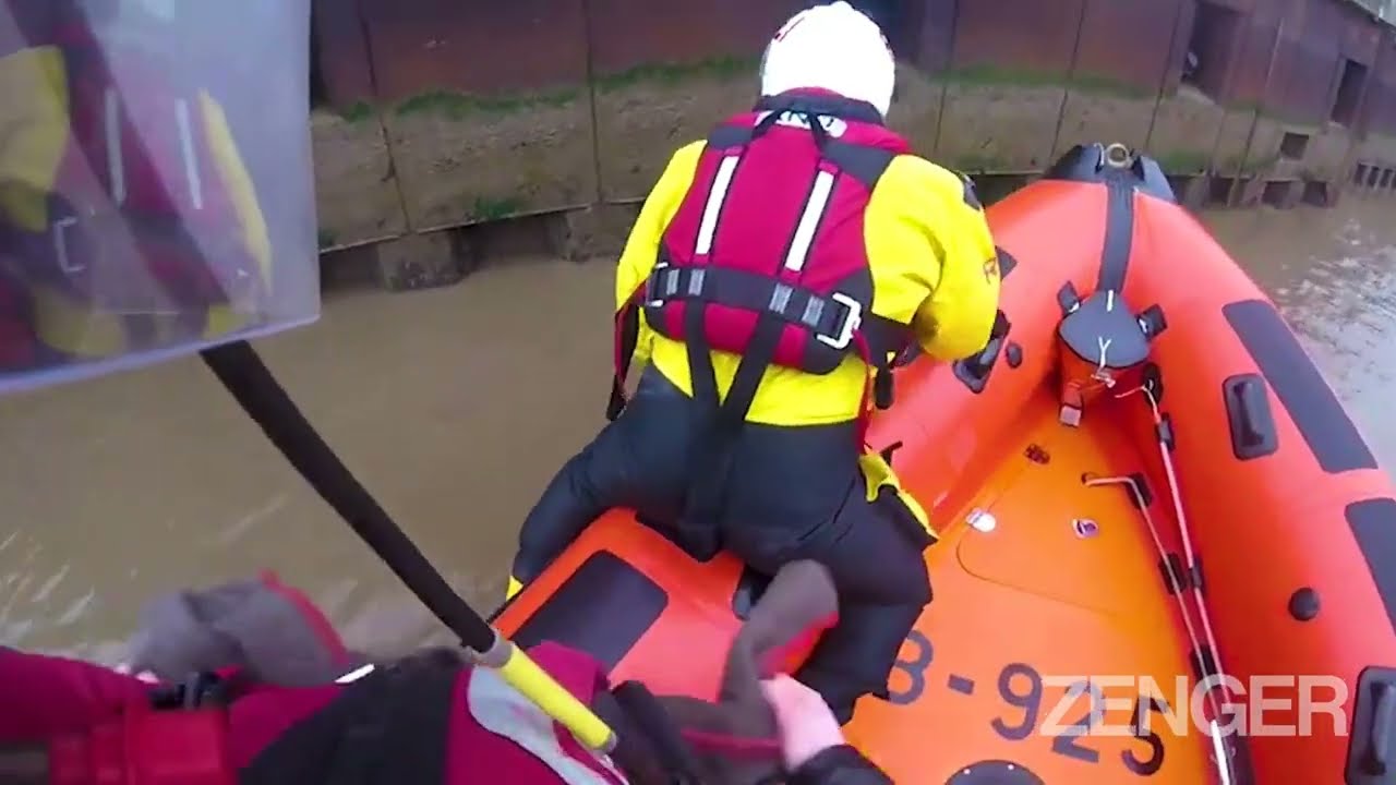 RNLI Rescue Cat In River Near Norfolk Pub And Wrap The Soggy Moggy In Blanket