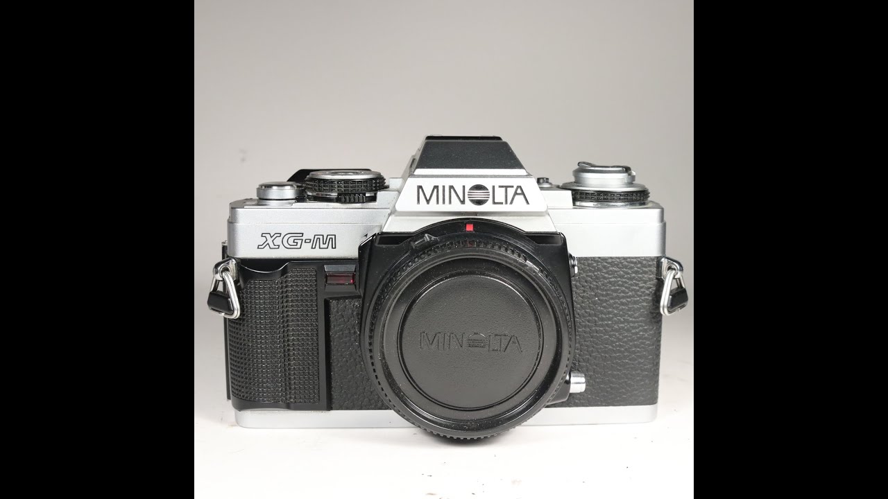 Minolta XG-M 35mm Film SLR Camera Body being checked over for condition