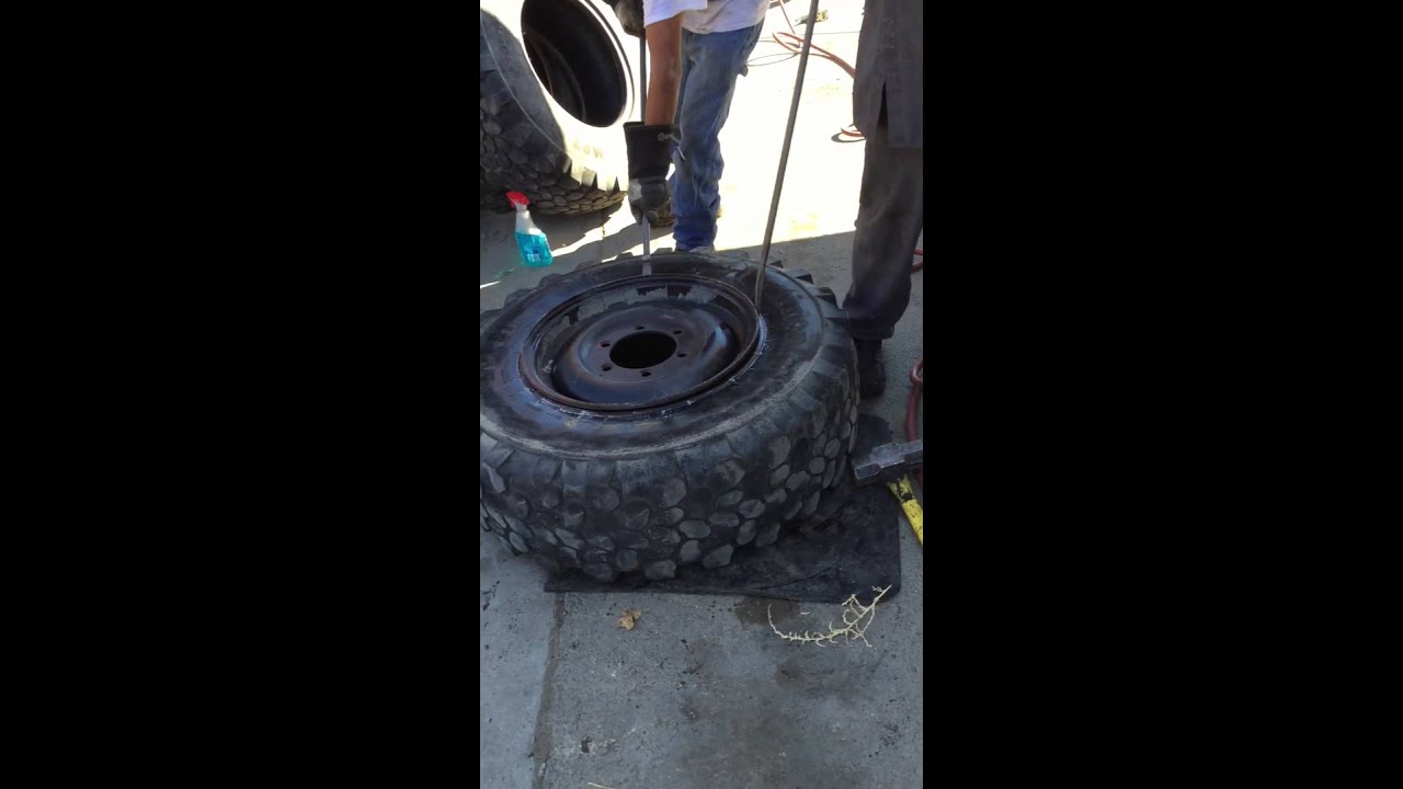 Remove large tire with hand tools