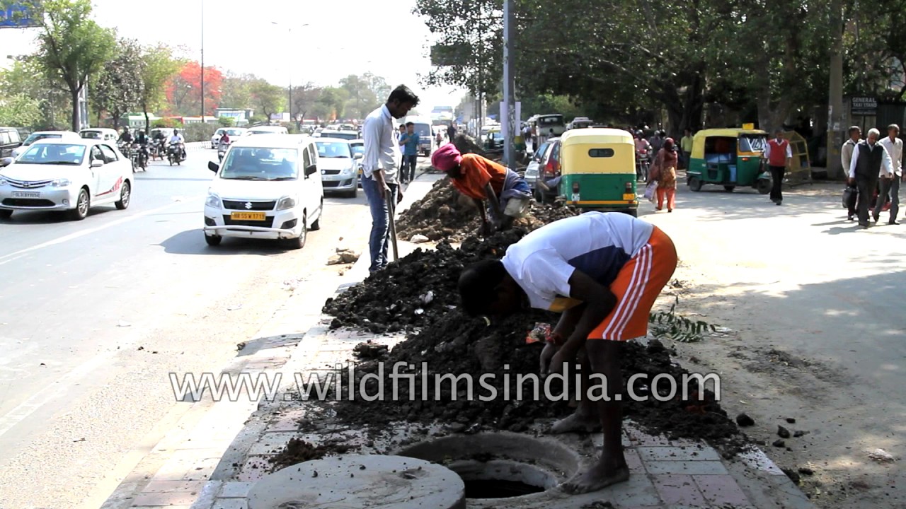 Cleaning the drains of Delhi - sad, pathetic job to have to do...