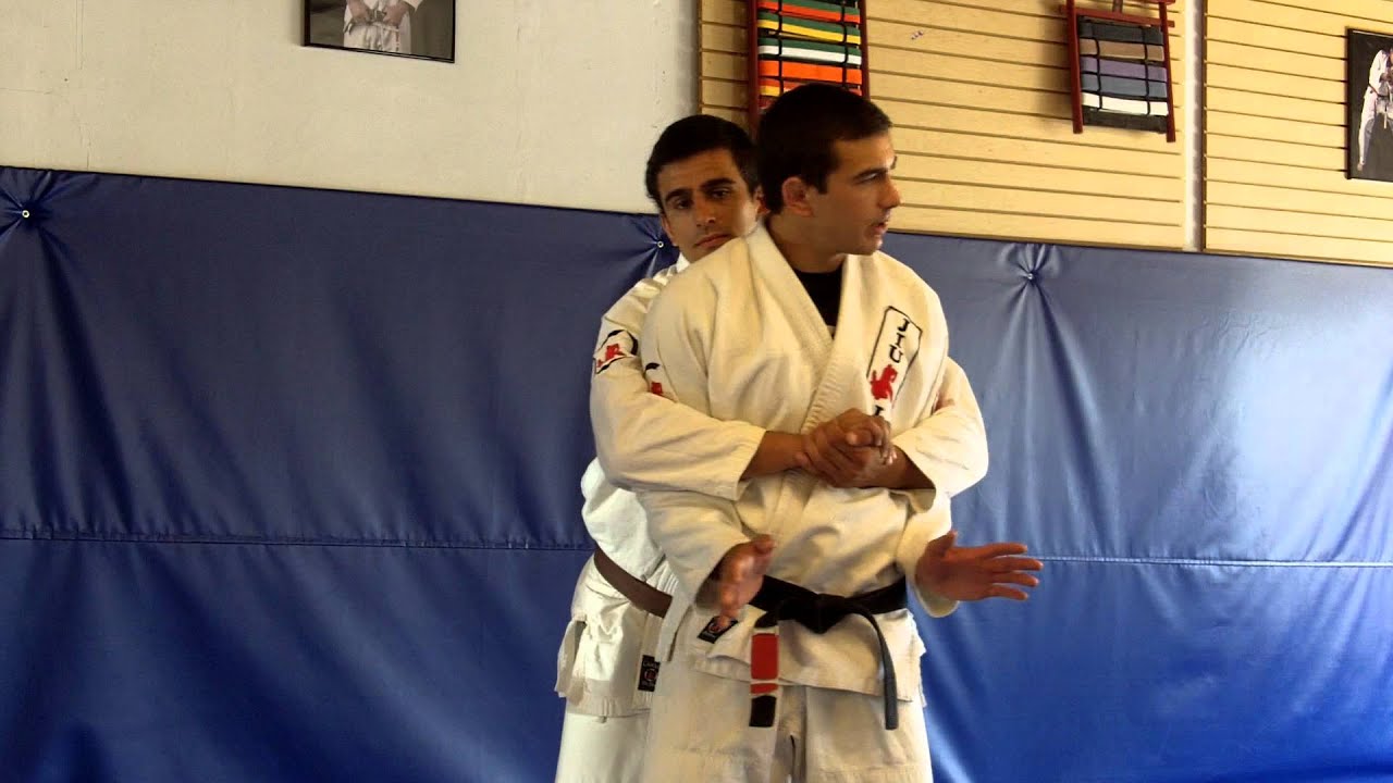 Rear Bear Hug over the arms Defense using head butt