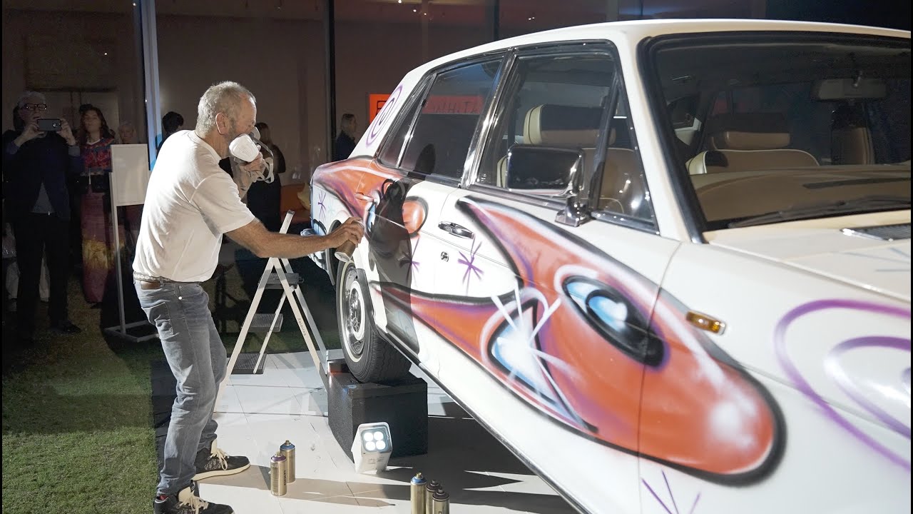 Artist Kenny Scharf spray paints a 1989 Rolls-Royce live at the Norton