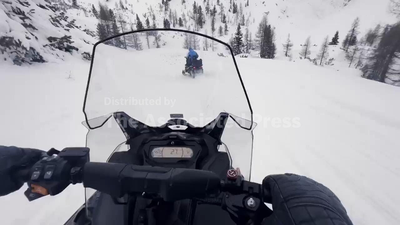 Exploring the peaks near Winter Olympics mountain venue on an 'Uber Snowmobile'