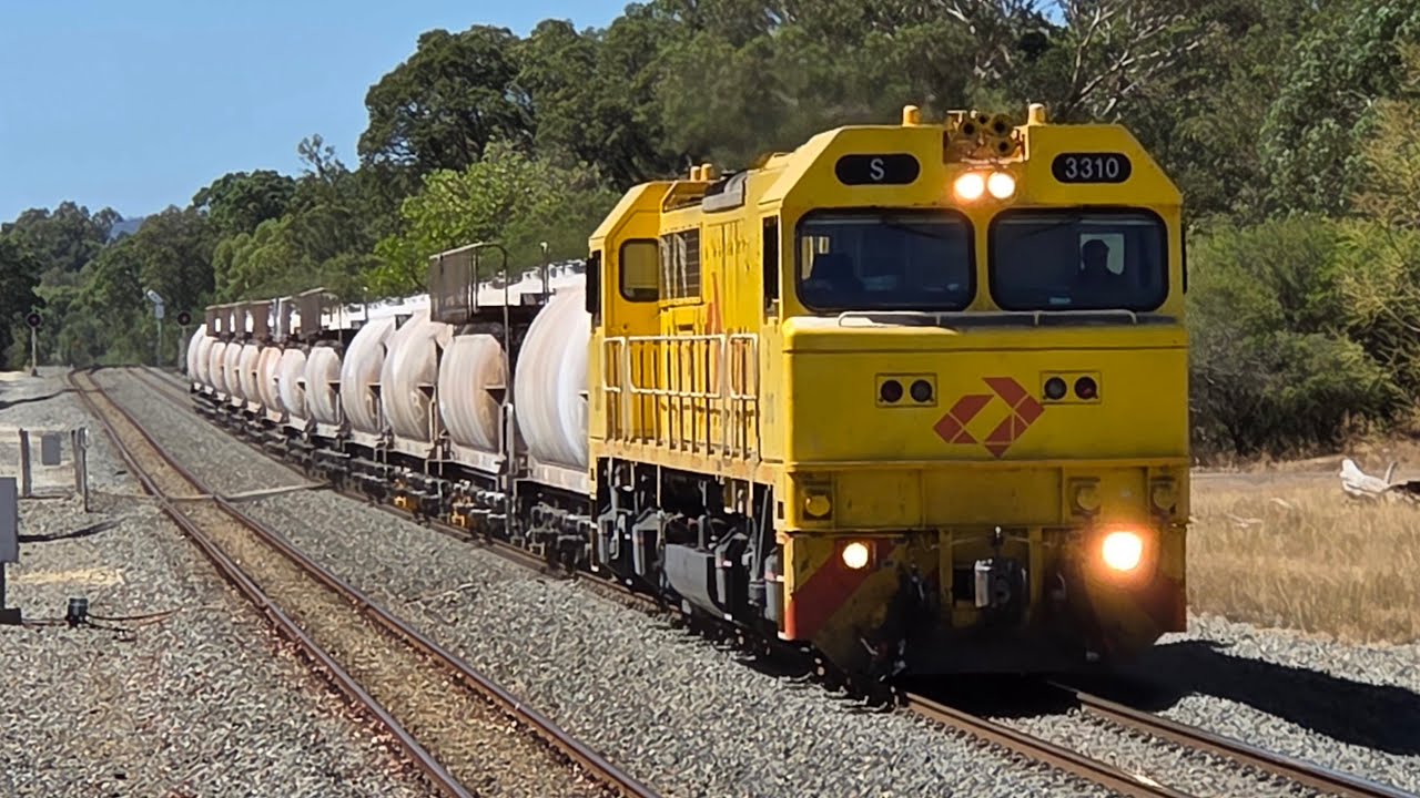Aurizon’s S3310 leads a loaded lime service at medium speed through Mundijong station 