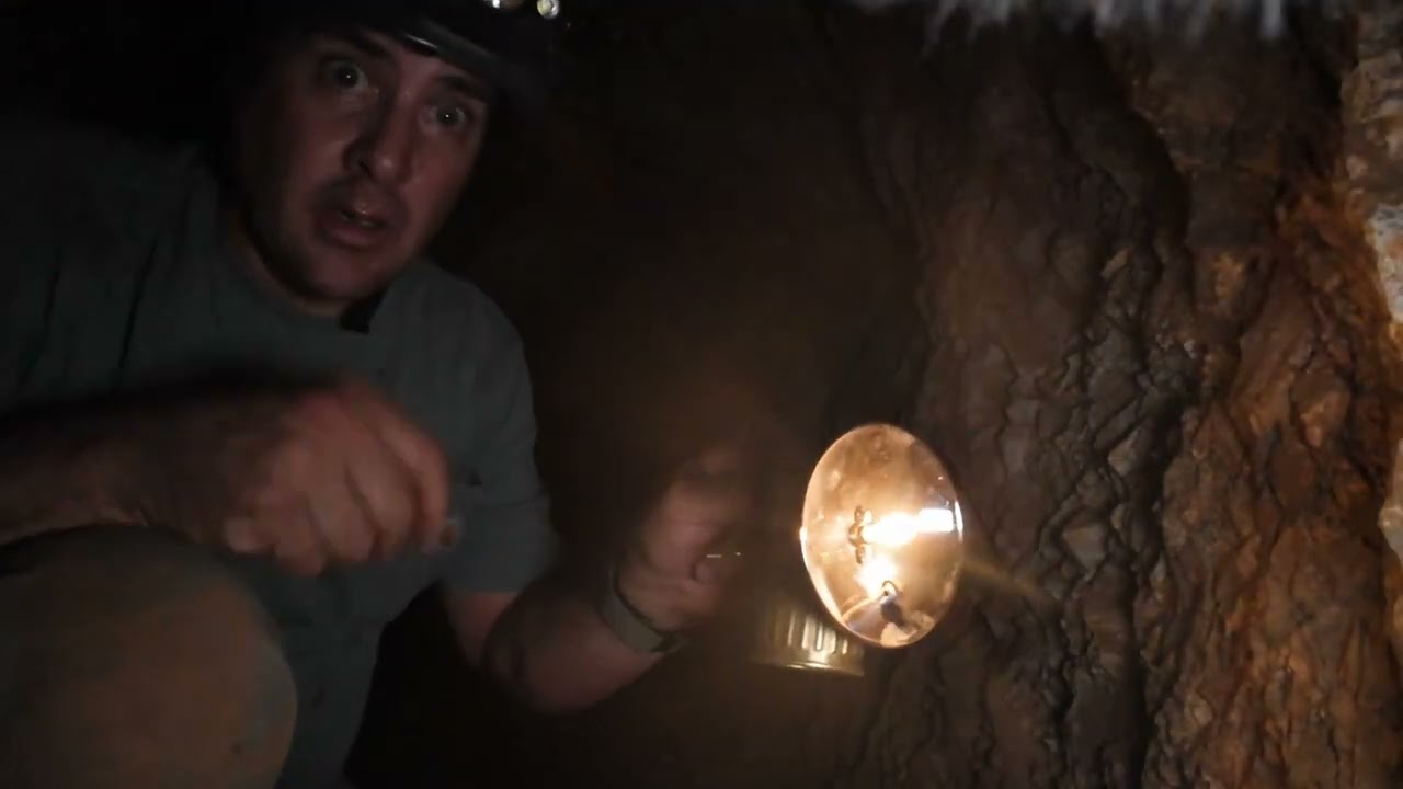 A demonstration of a carbide lamp in a 1870s gold mine