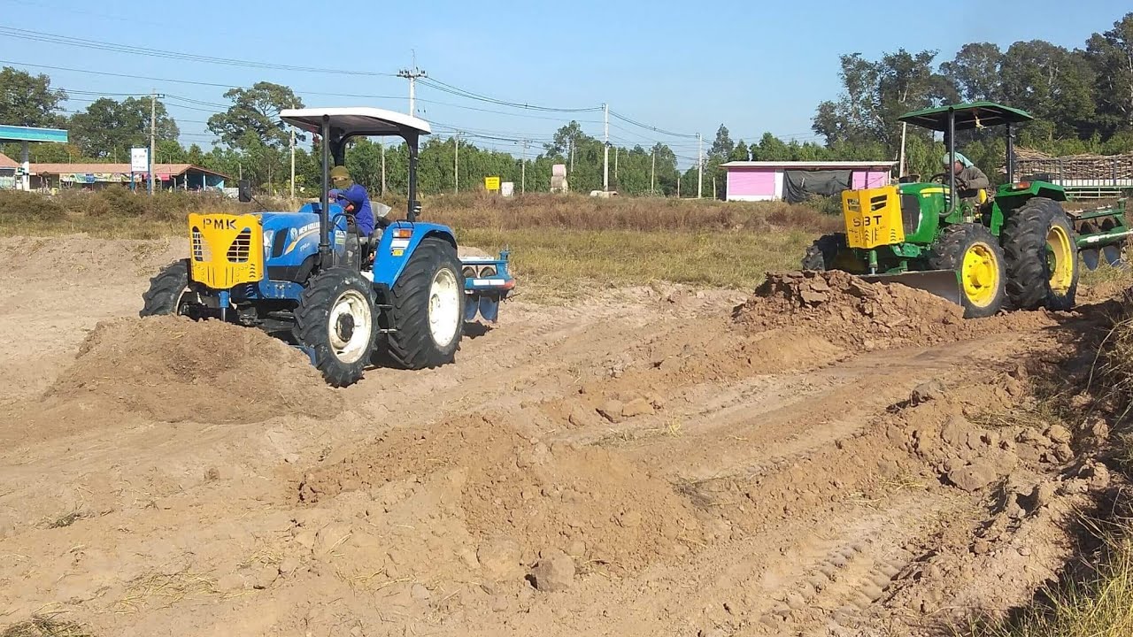 เปรียบเทียบรถไถ NEW HOLLAND TT4.65กับ JONE DEER 5O65E งานดันโพน ปรับที่ /ไร่นพรอ้อย-มัน