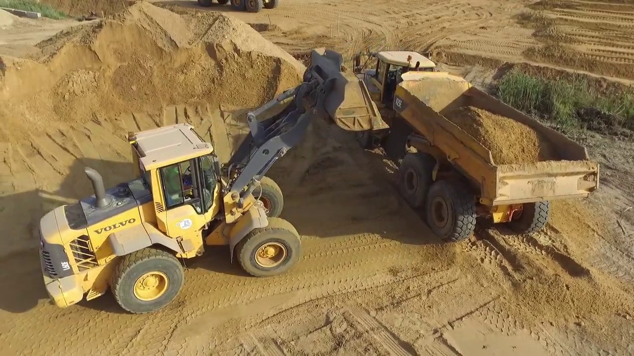 Volvo L60F loading Volvo ADT`s - Drone video