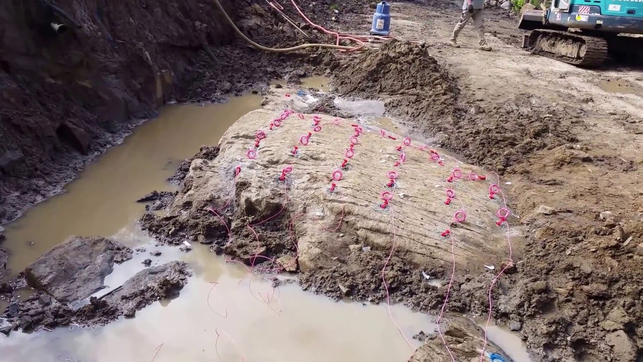 Blasting hard rock on a home site cut at Belgrave South