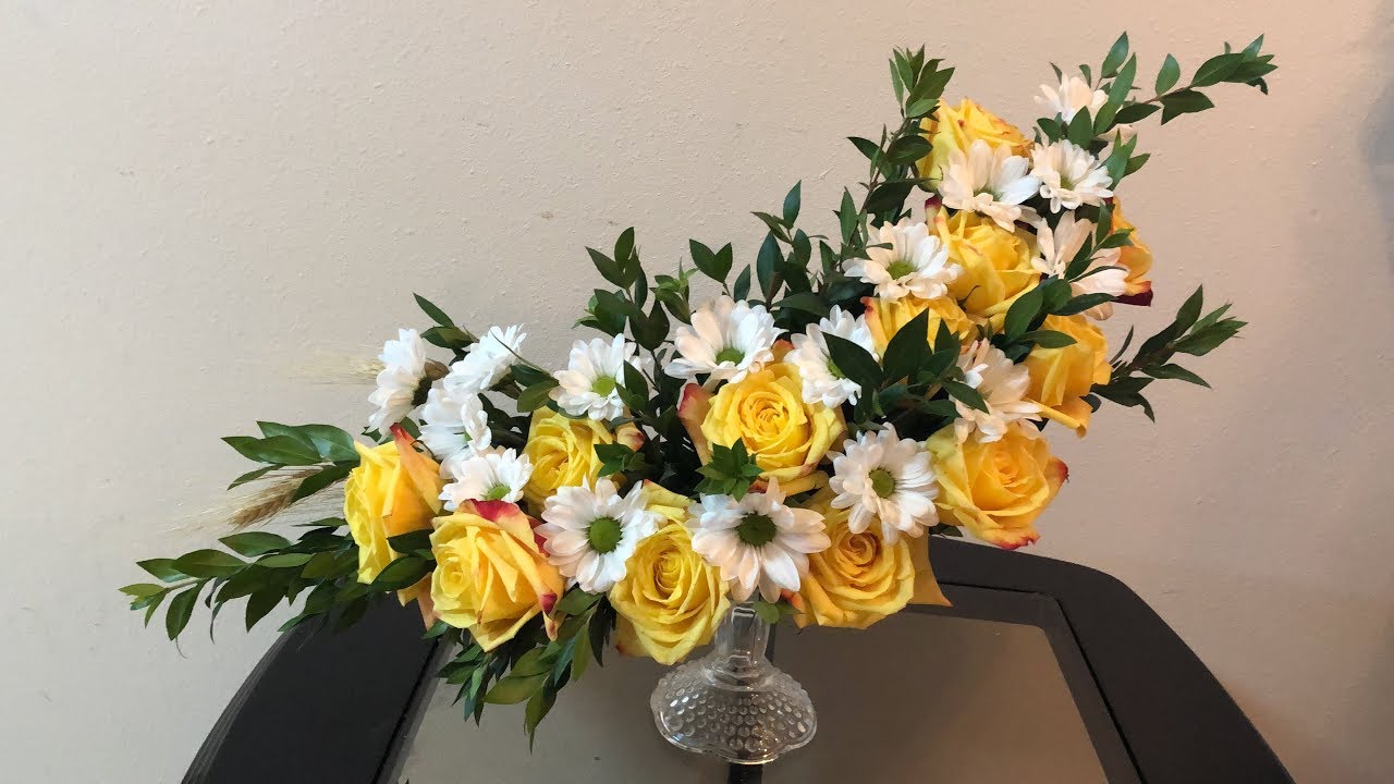 cómo hacer un arreglo floral en media luna.