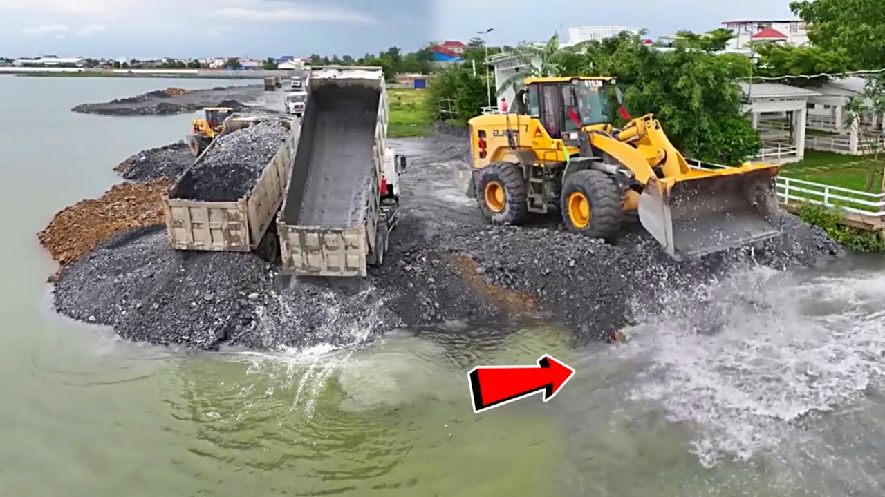 WOW!! VERY NICE MACHINERY WORKING, STRONG WHEEL LOADER PUSHING THE STONE INTO WATER, STONE ROAD