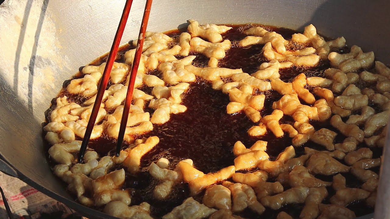 Cooking show.How to make Youtiao Thailand street food : Chinese Fried Dough Stick