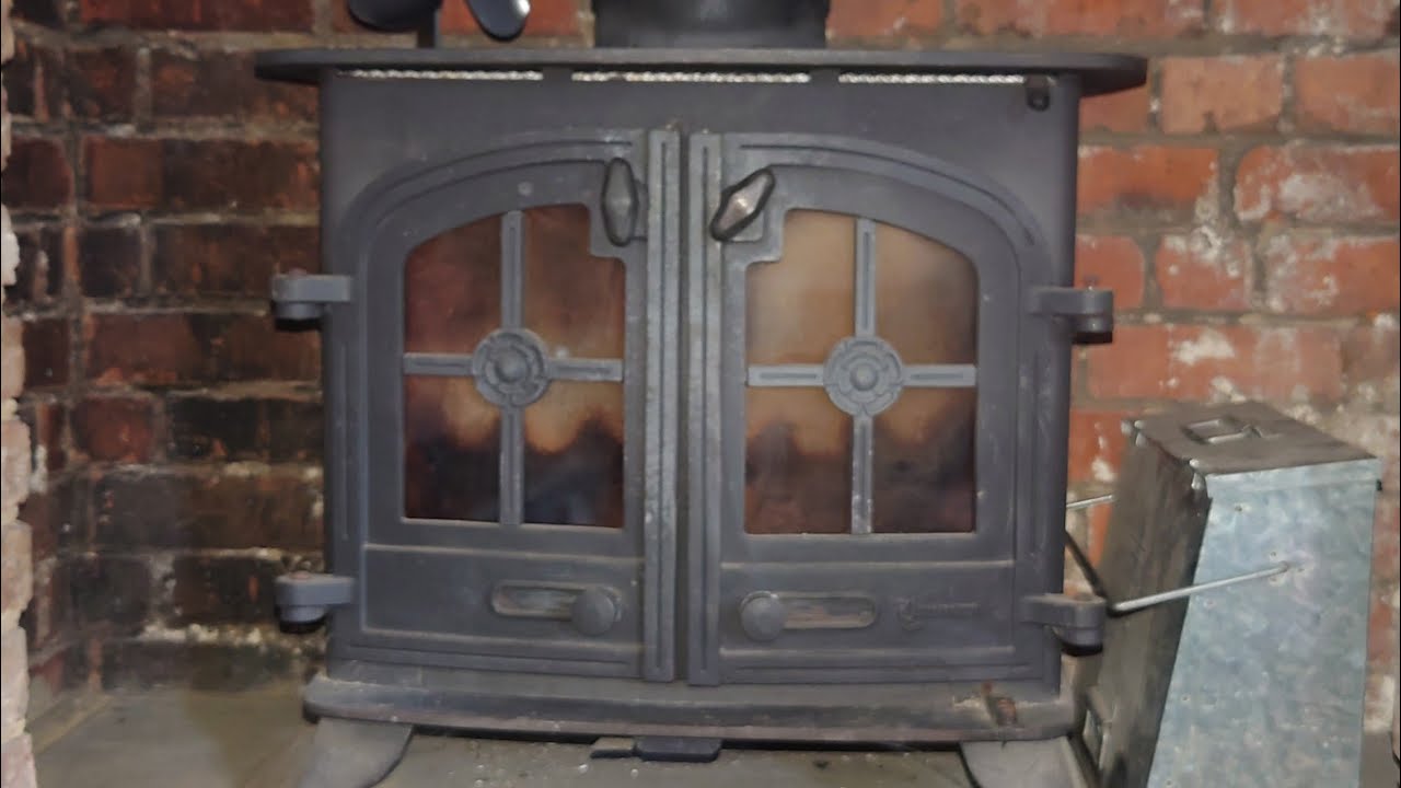 RESEALING A YEOMANS WOOD BURNING  STOVE PIPE AND REMOVING BAFFLE PLATE.