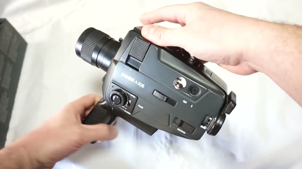 Bauer A 508 loading Super 8 film and batteries on Super 8 camera Bauer A 508 TOP MODEL